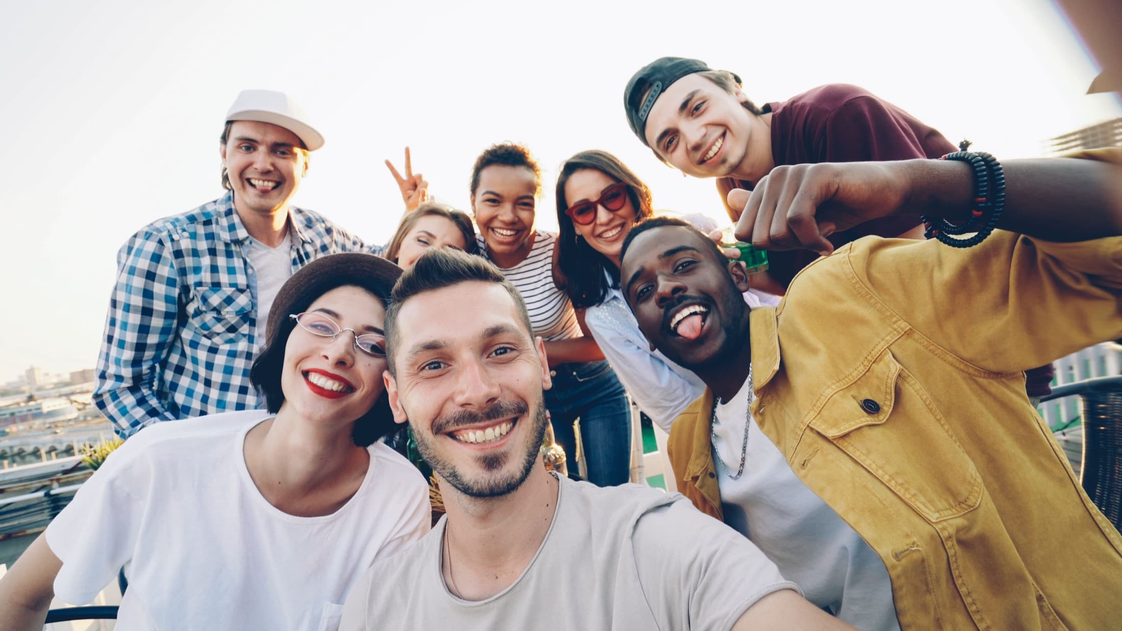 Group taking a selfie at an outdoor social event